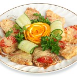 Meat snack with cheese and tomatoes, decorated with a rose from